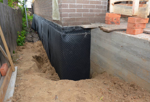 Happy homeowners after waterproofing job in Saint Nazianz